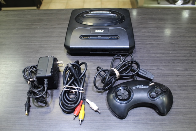 Console Genesis Model + acc 2 (manque porte cote)